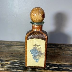 Made in Italy alcohol decanter leather wrapped.  Wooden top.